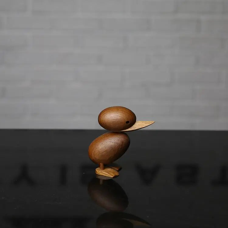 Familia de Patos en esculturas de madera.