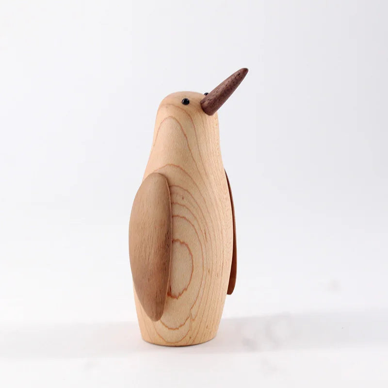Pingüinos en Escultura de Madera.