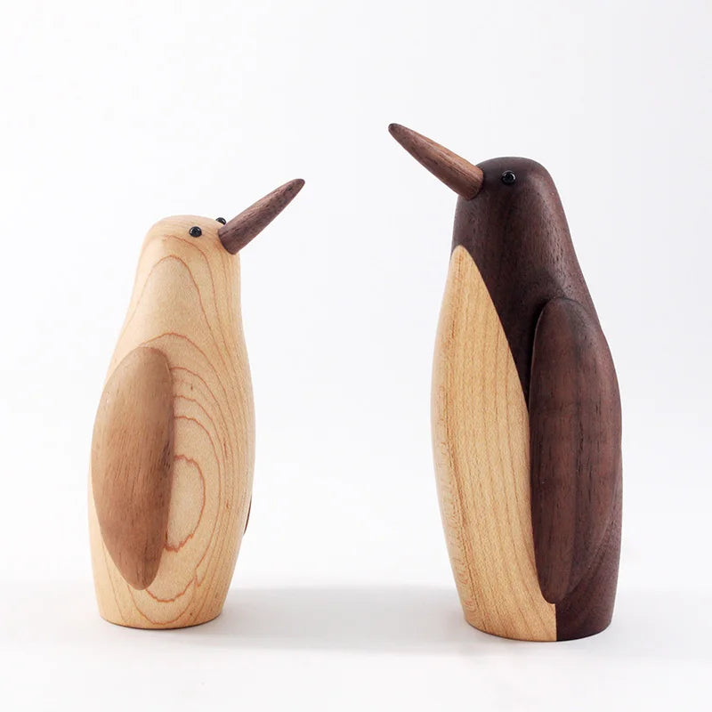 Pingüinos en Escultura de Madera.